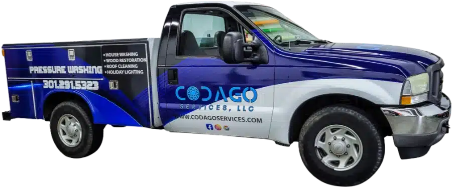 A blue and white Codago Services truck displaying Pressure Washing and other services, with contact information on the side.