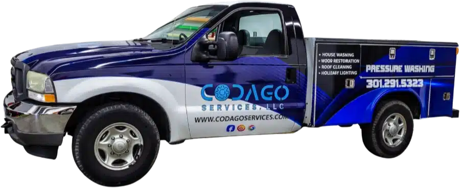 A blue and white pickup truck with CODAGEO SERVICES, LLC branding and service details for pressure washing and cleaning.